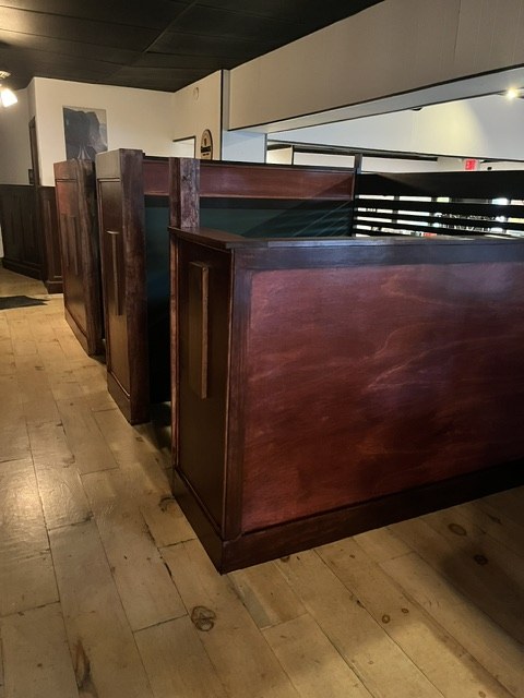 The finished row of mahogany partitions, floor clear