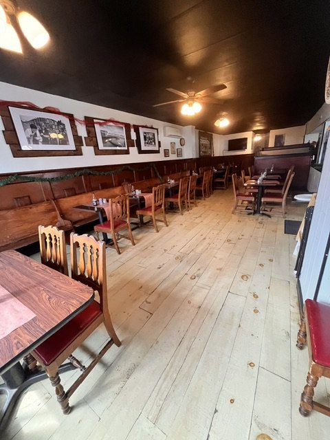 The dining room in mahogany and plank floor