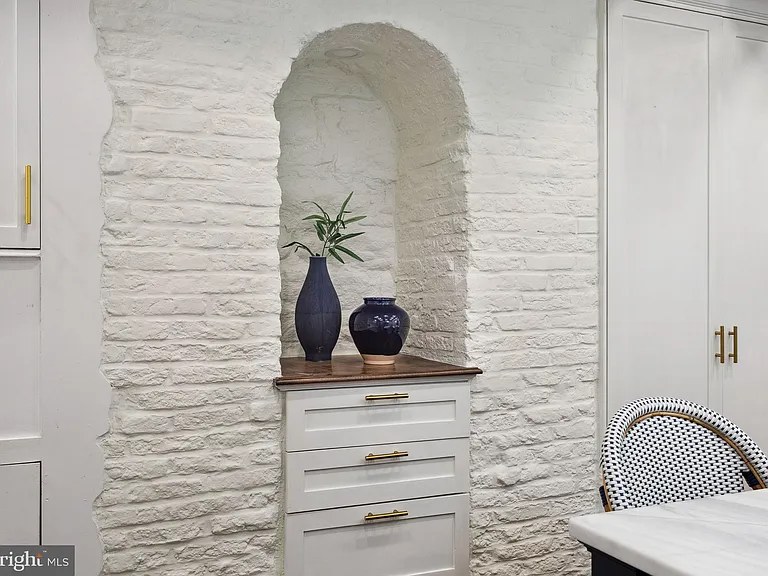 Arched niche in white-painted brick