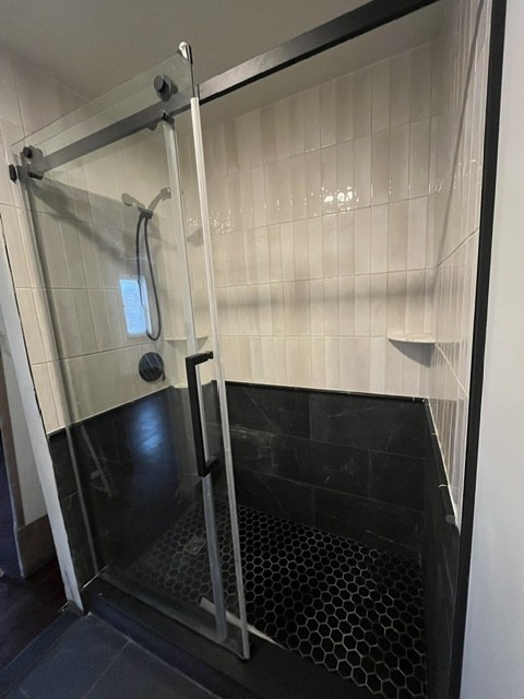 Glass shower on a black base