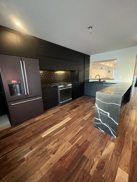 Matte black run and acacia floor