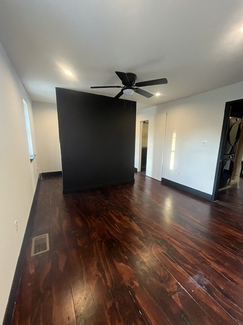 Accent wall in matte black under a fan