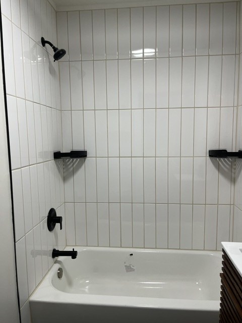 Tub and shower in white tile
