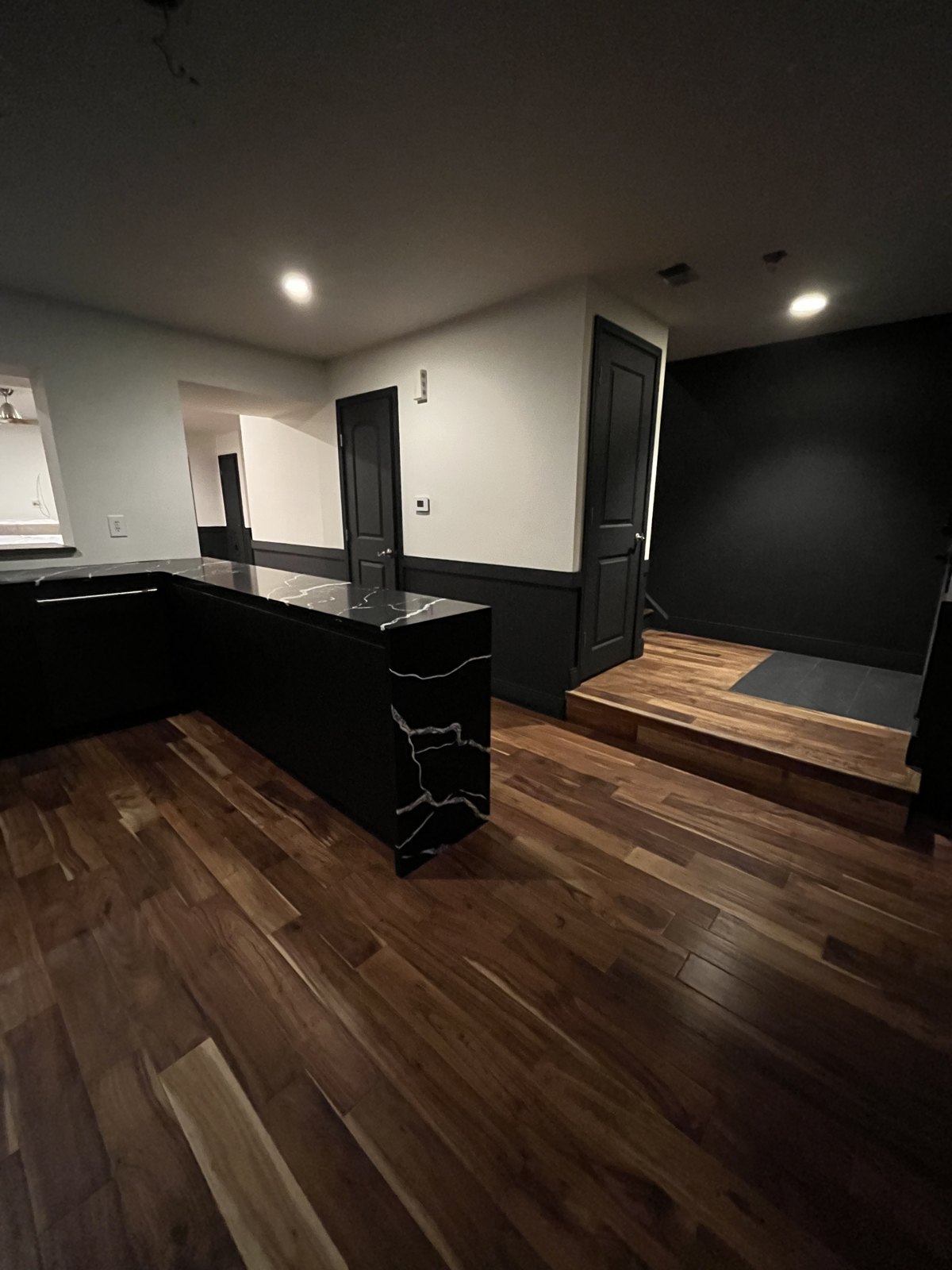 Black kitchen looking through