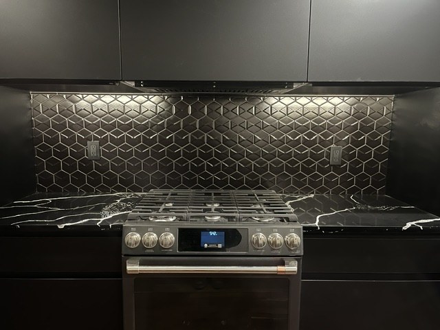 Hex-tile backsplash lit from under the cabinets