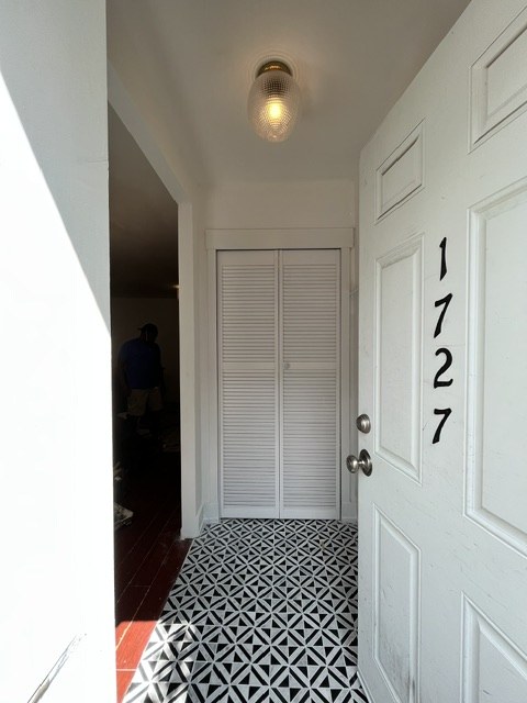 Patterned tile at the door