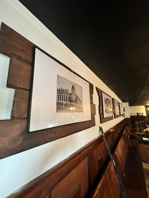 Framed prints on the wainscot