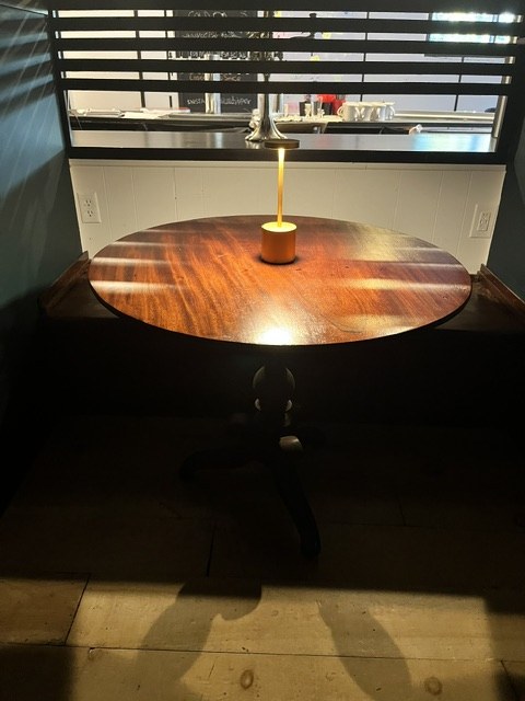 Lit table in a finished booth