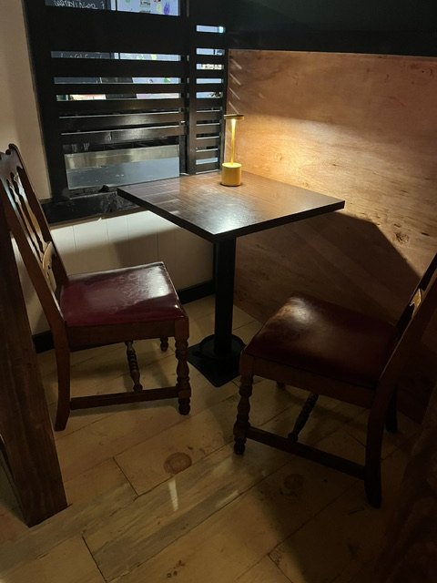 Table and chairs in a finished booth