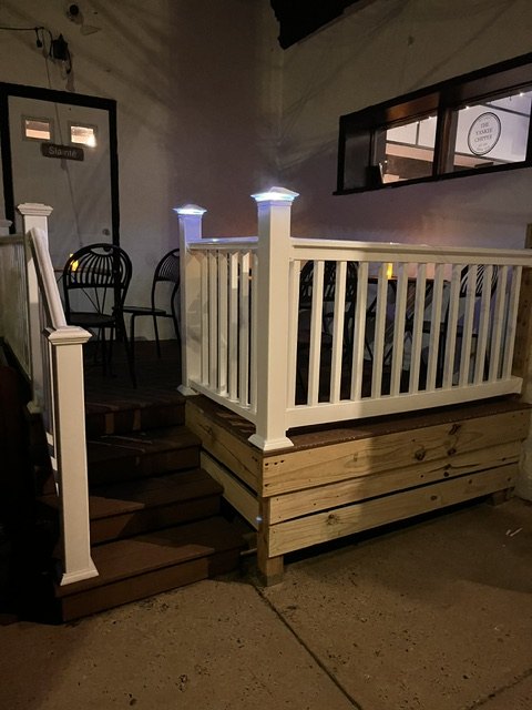 Deck and white rail outside